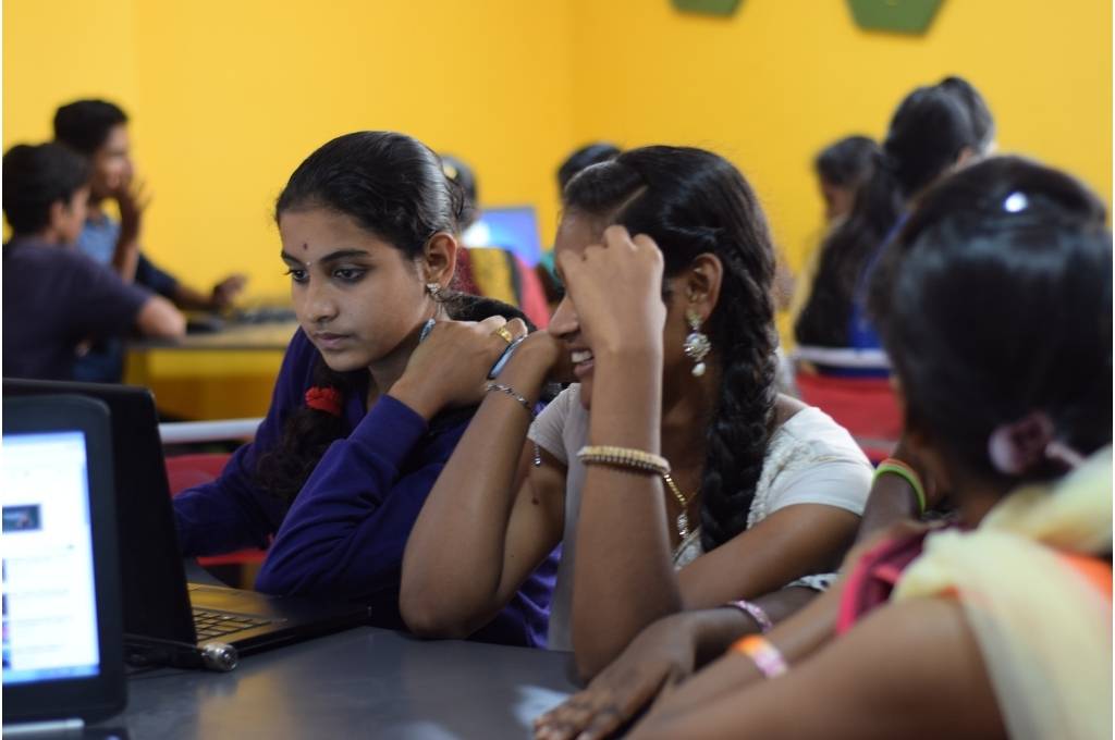 3 girls sitting in front of a laptop-social-emotional learning SEL