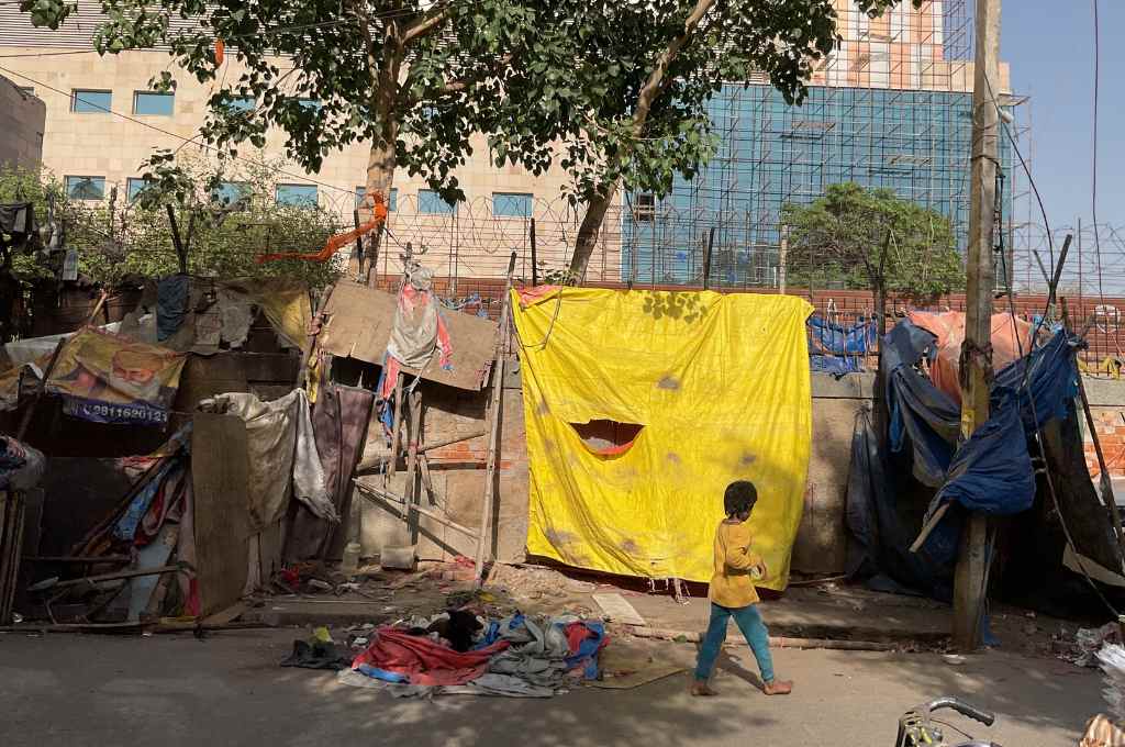 A child walking past a demolished house-demolition