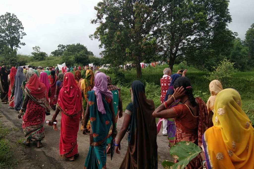 A group of women marching_coal mine