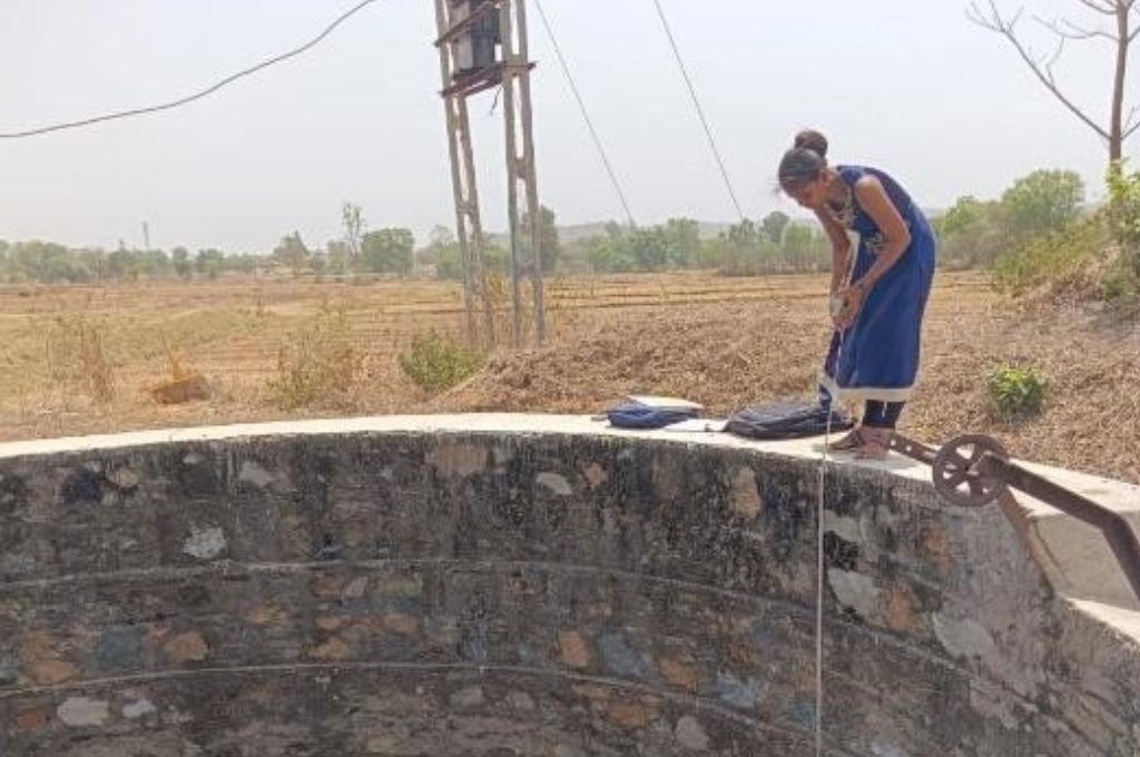 A woman fetching water from a well_forest resources