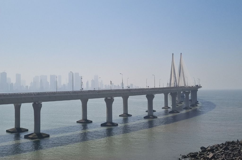 an image of a bridge with a background of a polluted environment