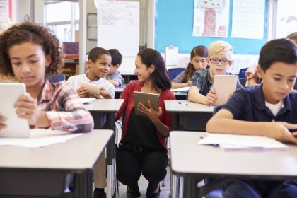 image of a teacher in a classroom with students