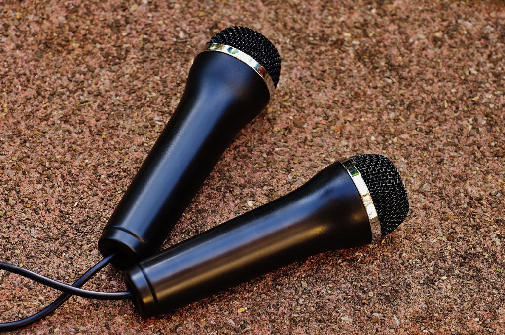 two black mics against a brown backdrop_nonprofit communication