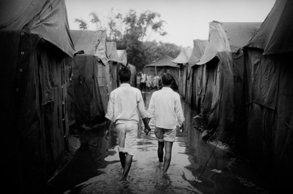 two young men walking hand in hand-gender discrimination