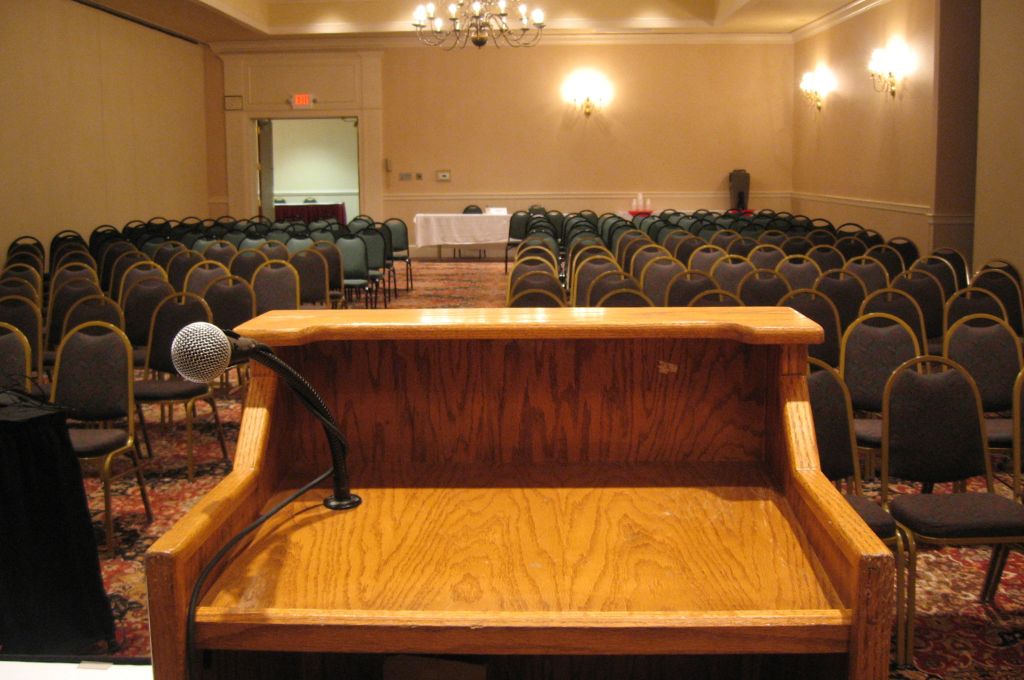 an empty room with chairs_caste