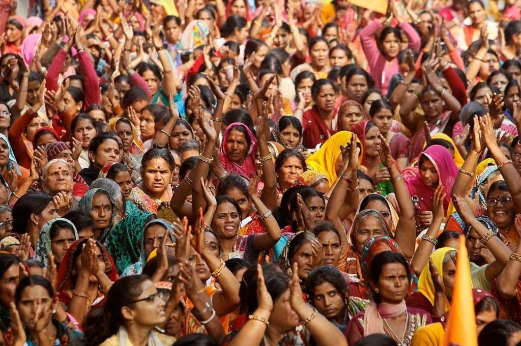 Women applauding at a gathering-FCRA